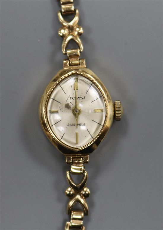 A ladys 9ct gold Accurist manual wind wrist watch.